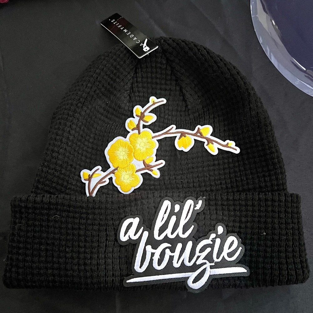 Black beanie with A LIL’ BOUGIE patch and yellow flowers